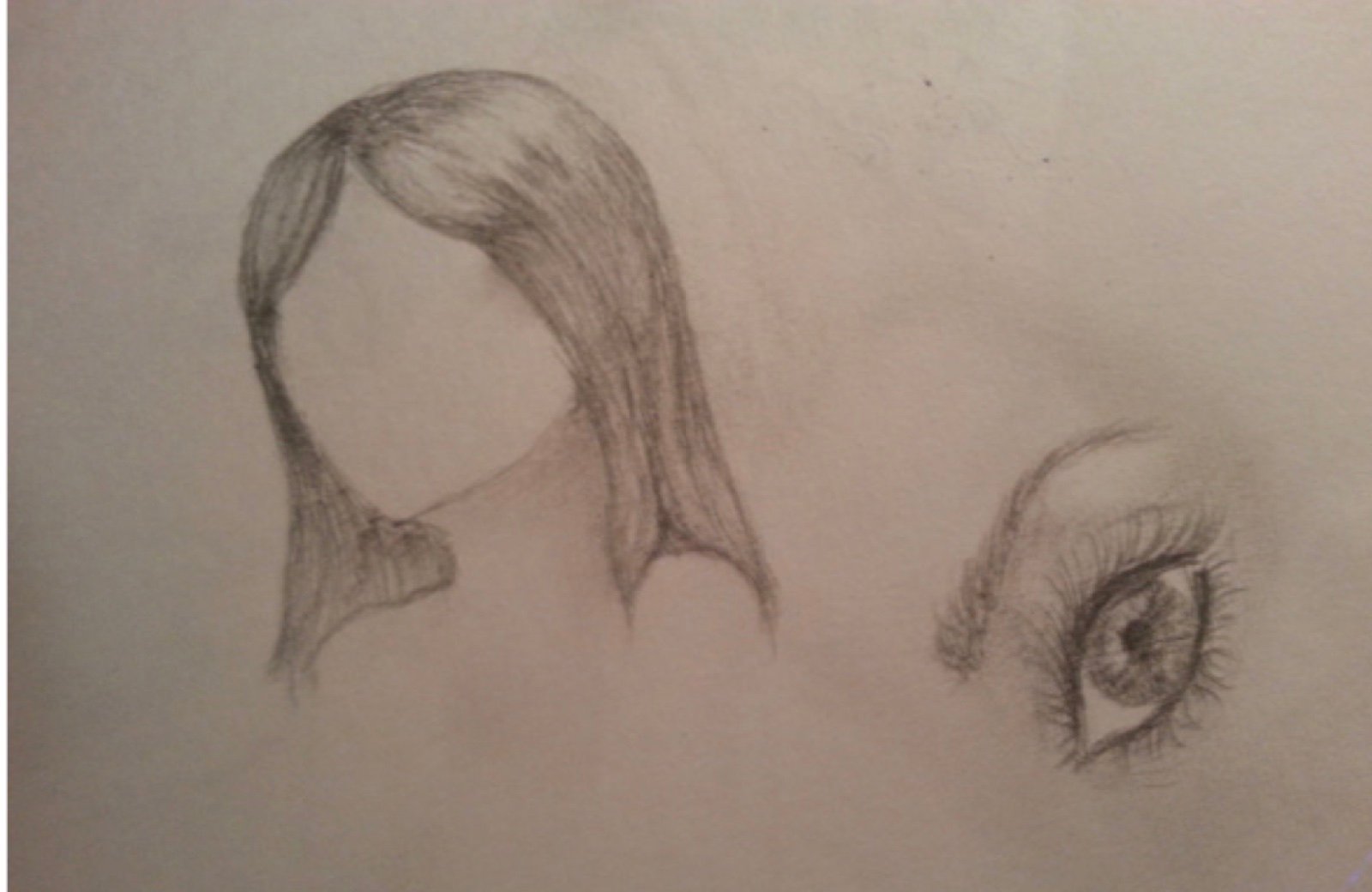 Pencil sketch of a faceless figure and a separate detailed eye study